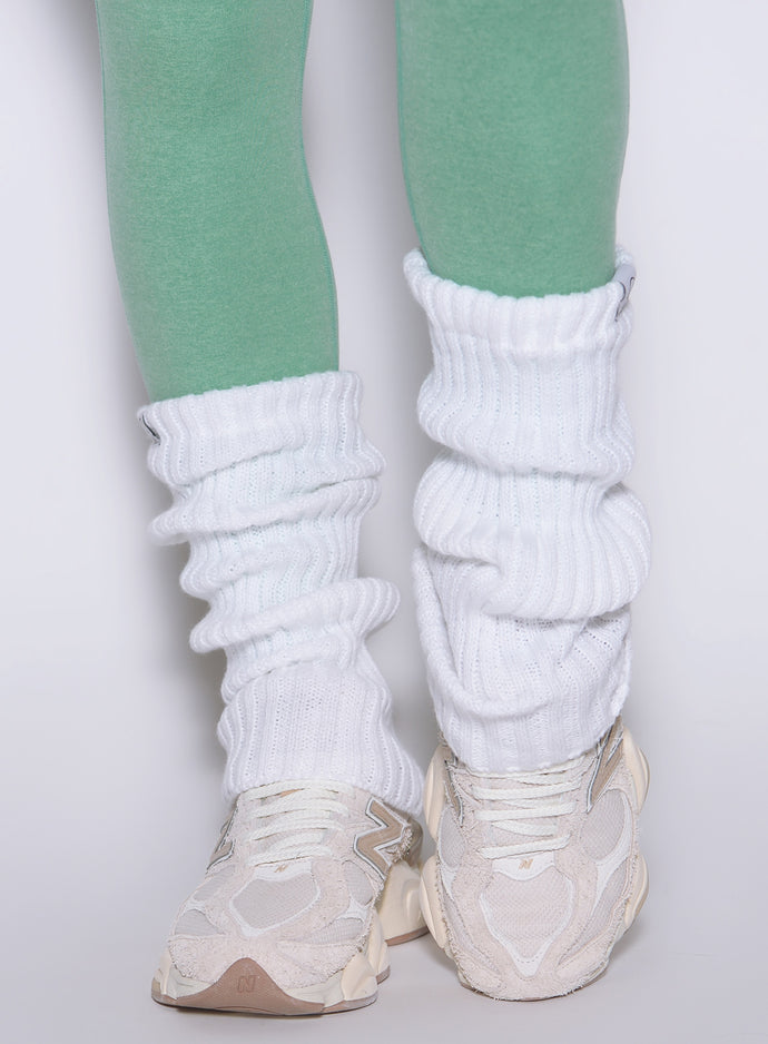 White Luxe Leg Warmers in a short, ribbed knit style for cozy layering over gym leggings.