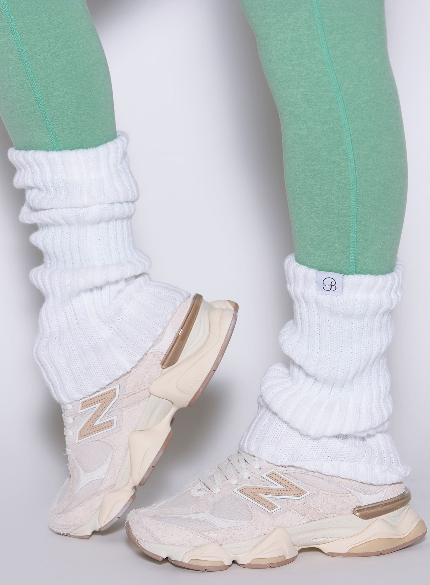 White Luxe Leg Warmers in a chunky rib knit, featuring a soft pull-on fit and sporty gym style.