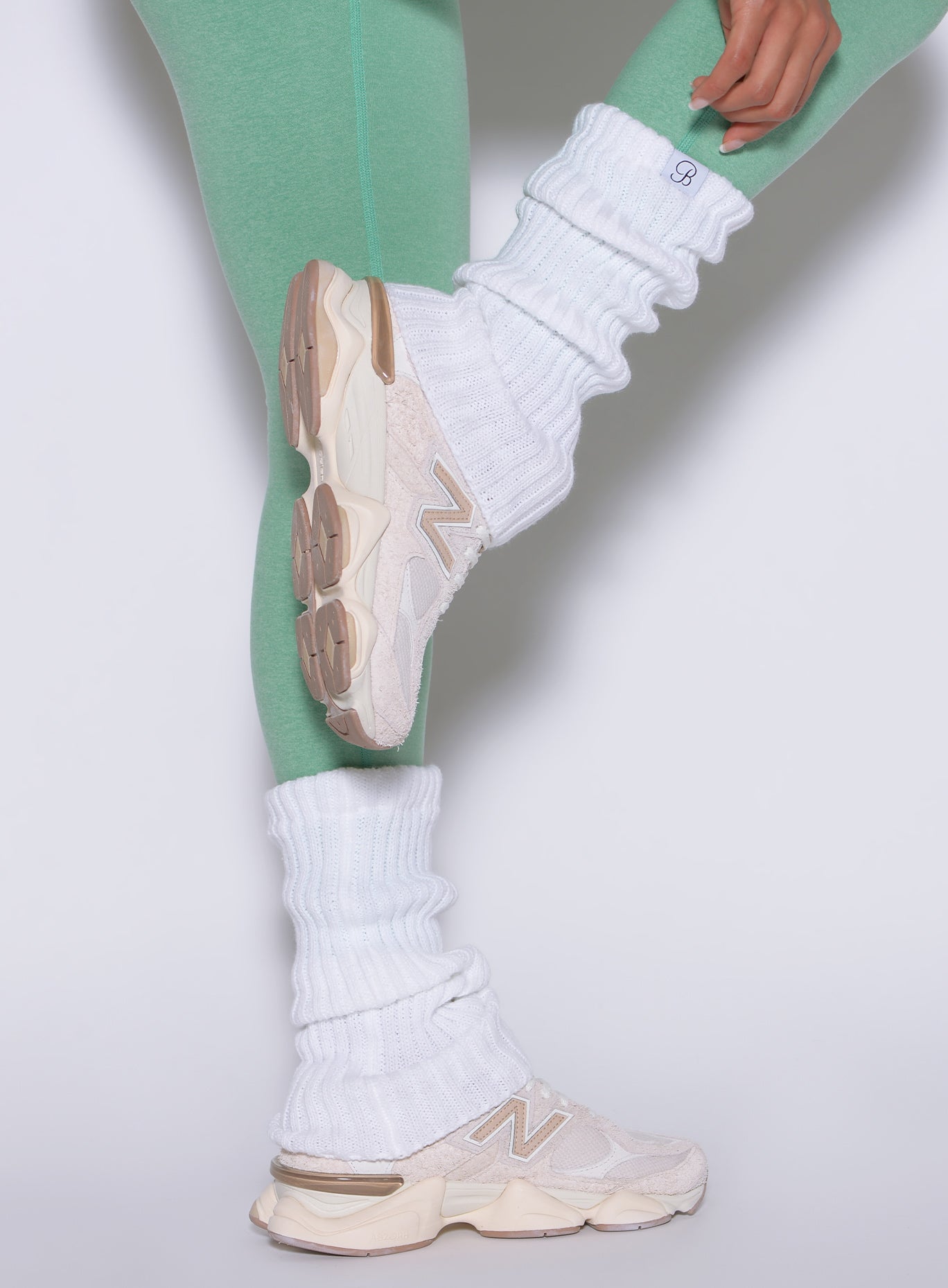 White Luxe Leg Warmers in a plush rib knit; short, breathable layering for gym outfits.