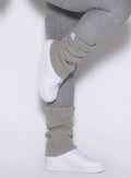 right side view of a model wearing the luxe leg warmers-short in dark and stormy color