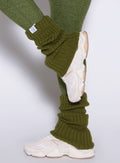 left side view of a model wearing the Luxe Leg warmers-short in Juniper color