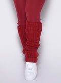 close up front view of a model wearing the Luxe Leg Warmers in red velvet color