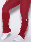close up left side view of a model wearing the Luxe Leg Warmers in red velvet color