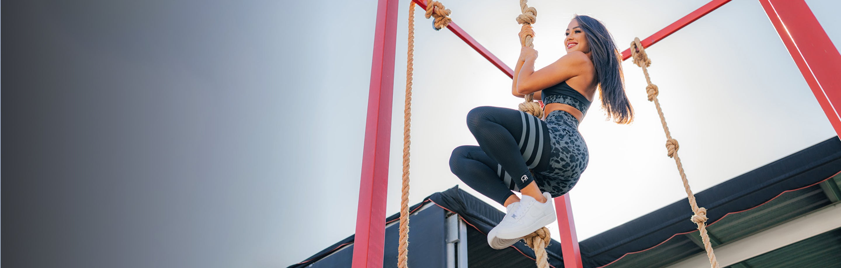 person rope climbing in a cheetah set