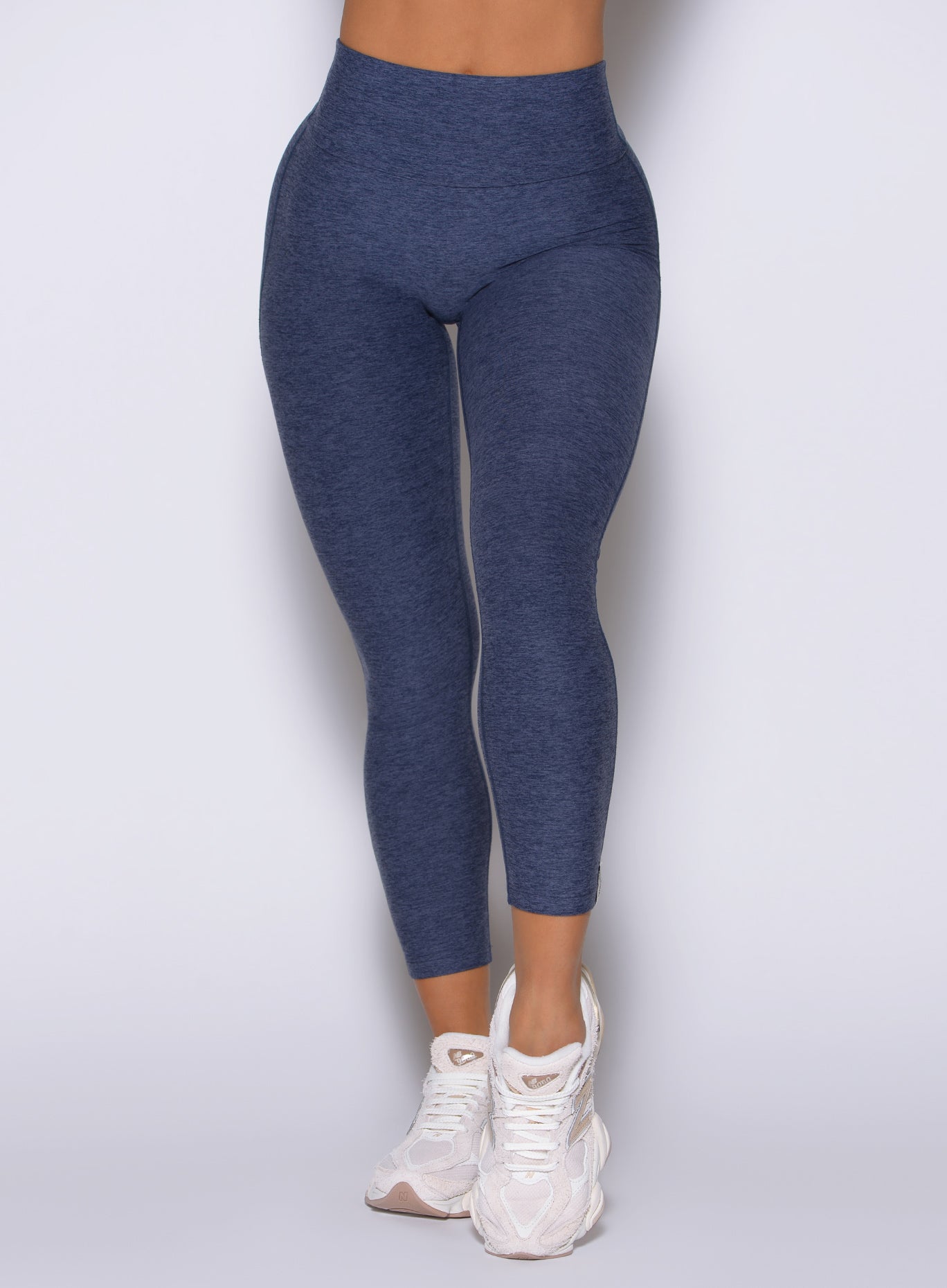 Space Blue Movement 7/8 Leggings featuring a high-waisted, glute-contouring fit for gym training.