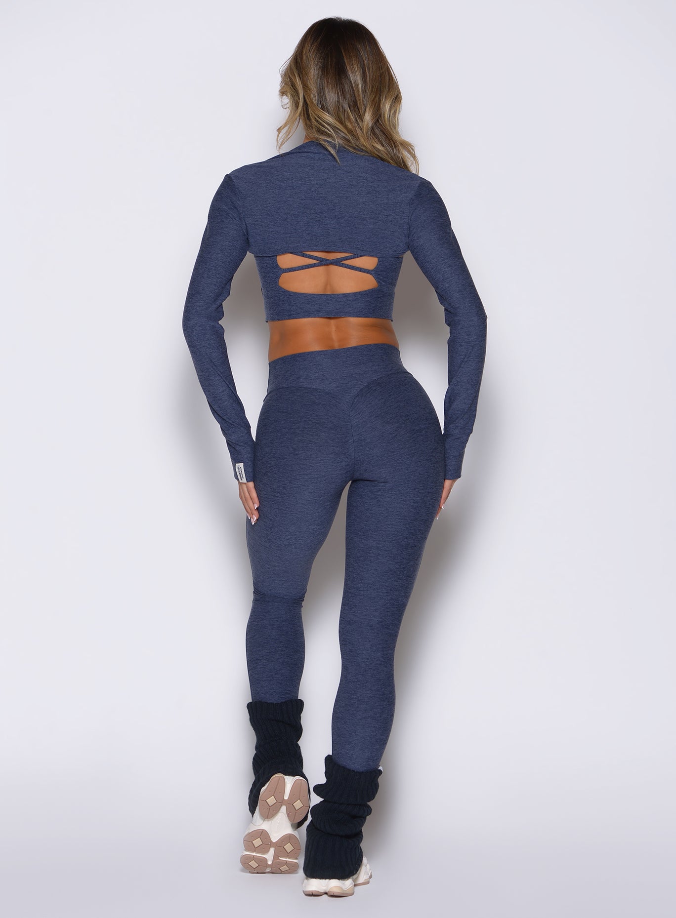Glute-sculpting Space Blue Movement 7/8 Leggings in heathered fabric for high-impact studio flows.