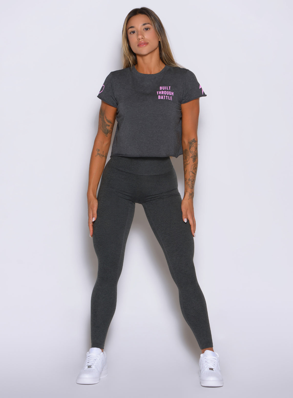 Body-hugging charcoal leggings pair a high waist with a smooth seamless front