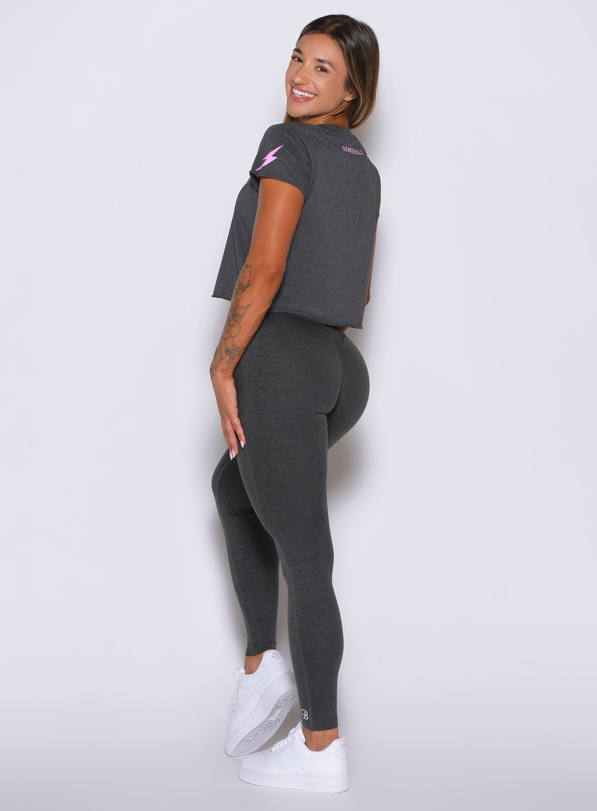 High-waisted charcoal Movement Leggings offer a sleek silhouette with four-way stretch