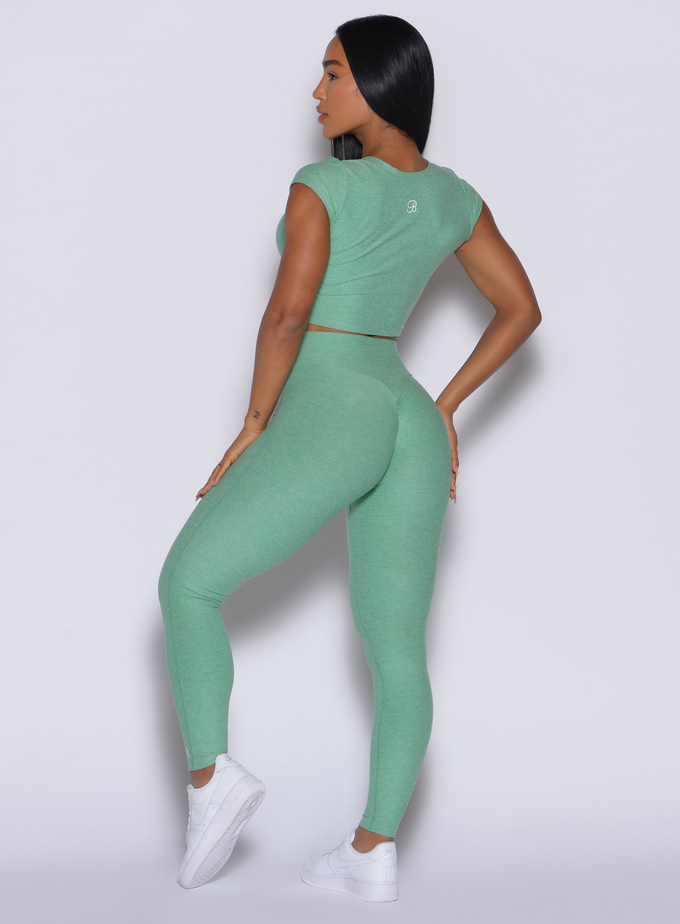 Sculpting Sage Movement Leggings with a sweetheart back seam and buttery soft, seamless gym fit.