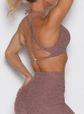 back right side profile view of a model wearing the MulTie Sports Bra in walnut color