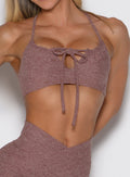 front view of a model showcasing the multi-way tie straps on the MulTie Sports Bra in walnut color