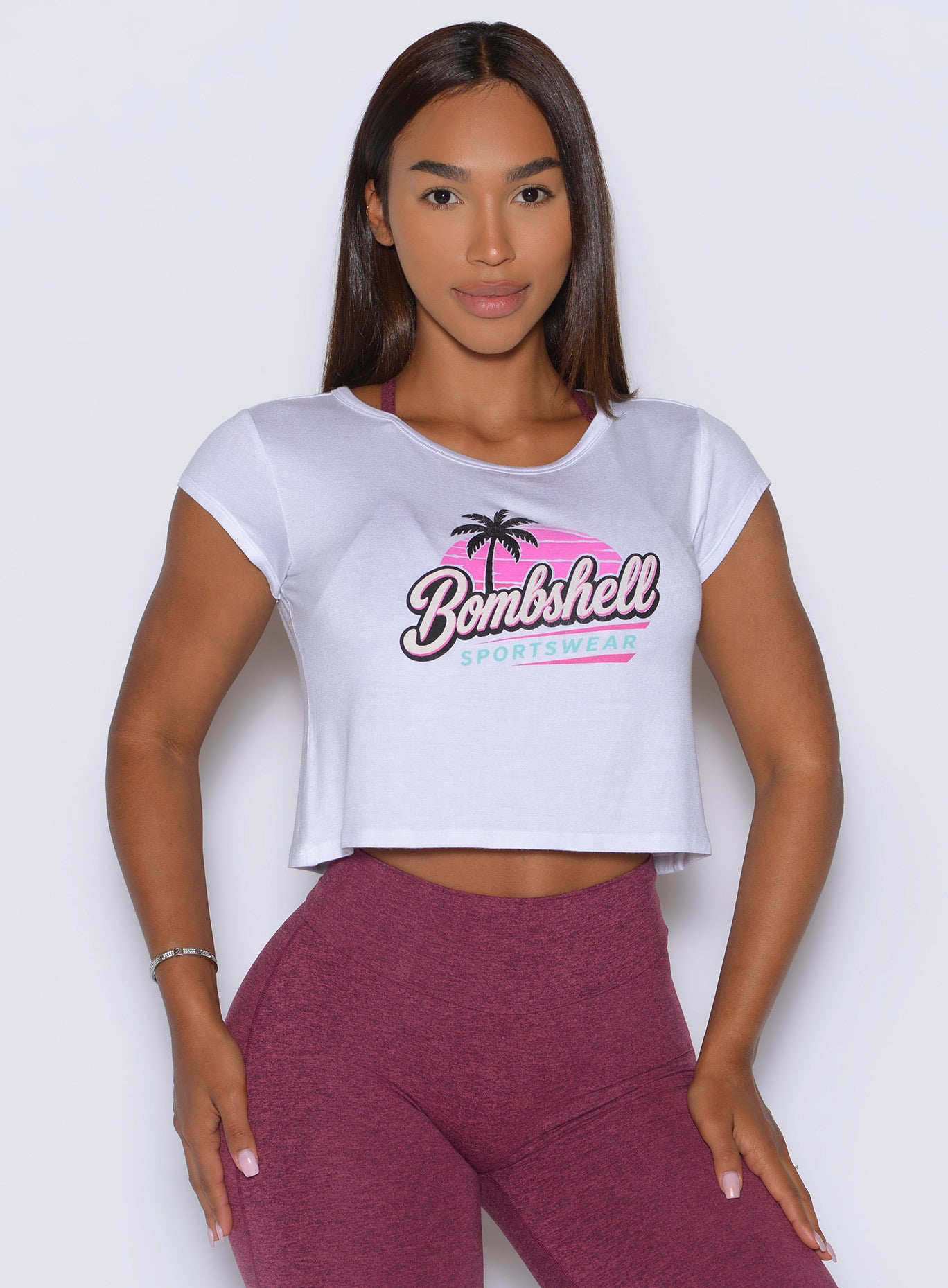 Signature Bombshell graphic stands out across the front of this lightweight white workout tee