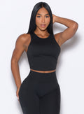 front profile view of a model wearing our Muscle Scrunch Tank in Black color
