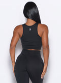 Back side close up view of model wearing the Muscle Scrunch Tank in Black color

