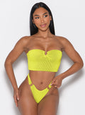 front profile view of a model looking to the left side wearing the Neon Nights Bikini Bandeau in Lemon Drop color