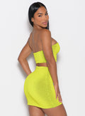 back right side profile view of a model looking over her shoulder wearing the Neon Nights Bikini Bandeau in Lemon Drop color