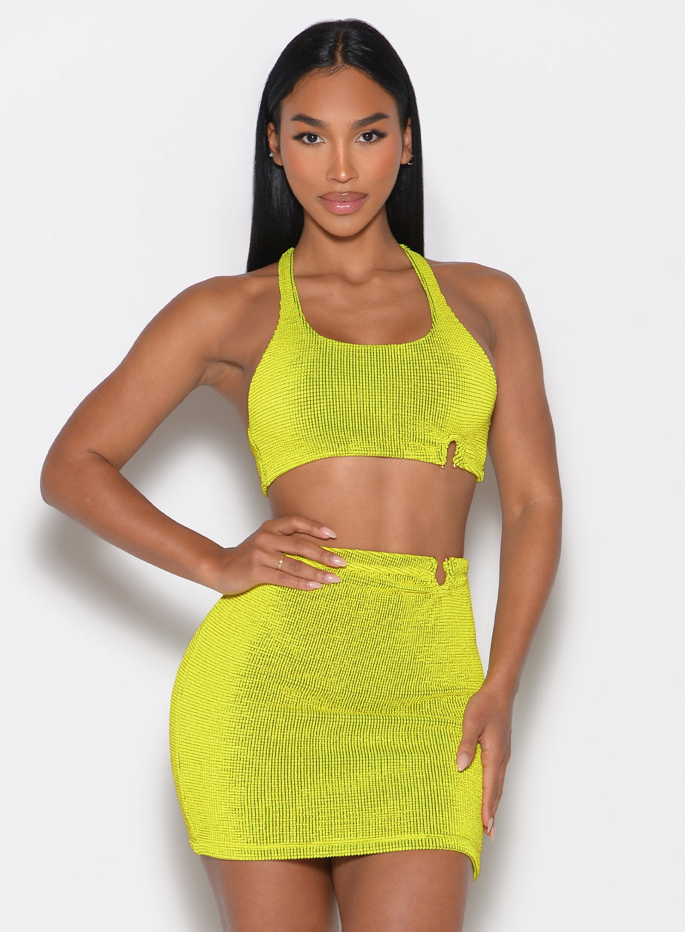 Vibrant Lemon Drop Neon Nights Bikini Top paired with a matching skirt for glam poolside style.