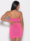 back profile view of a model with one hand on her waist wearing the Neon Nights Bikini Bandeau in Pink Passion color