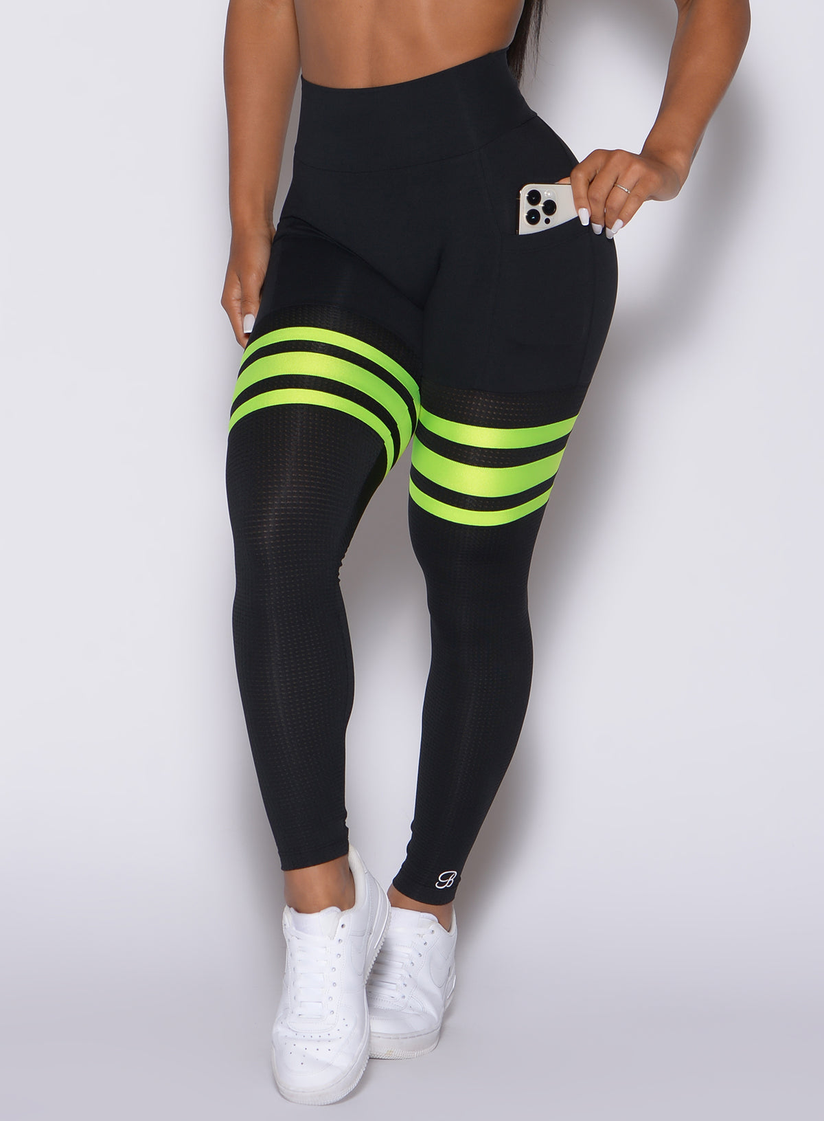 Neon Pink Scrunch Thigh-Highs with breathable mesh and side pockets for a sculpted gym look.