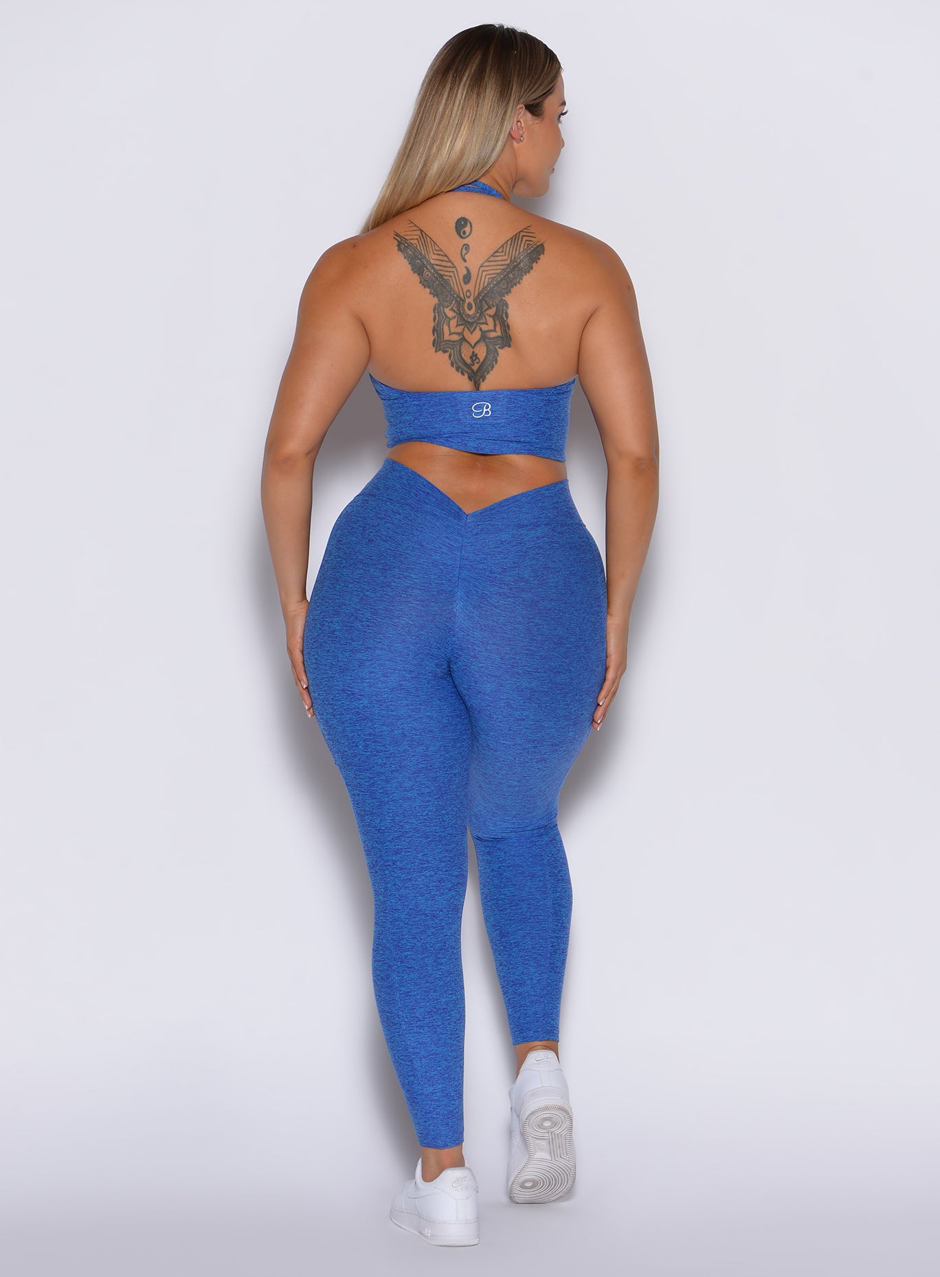 Neon Blue Rave V Back Leggings with a sculpting V-scrunch back and high-waist gym fit.