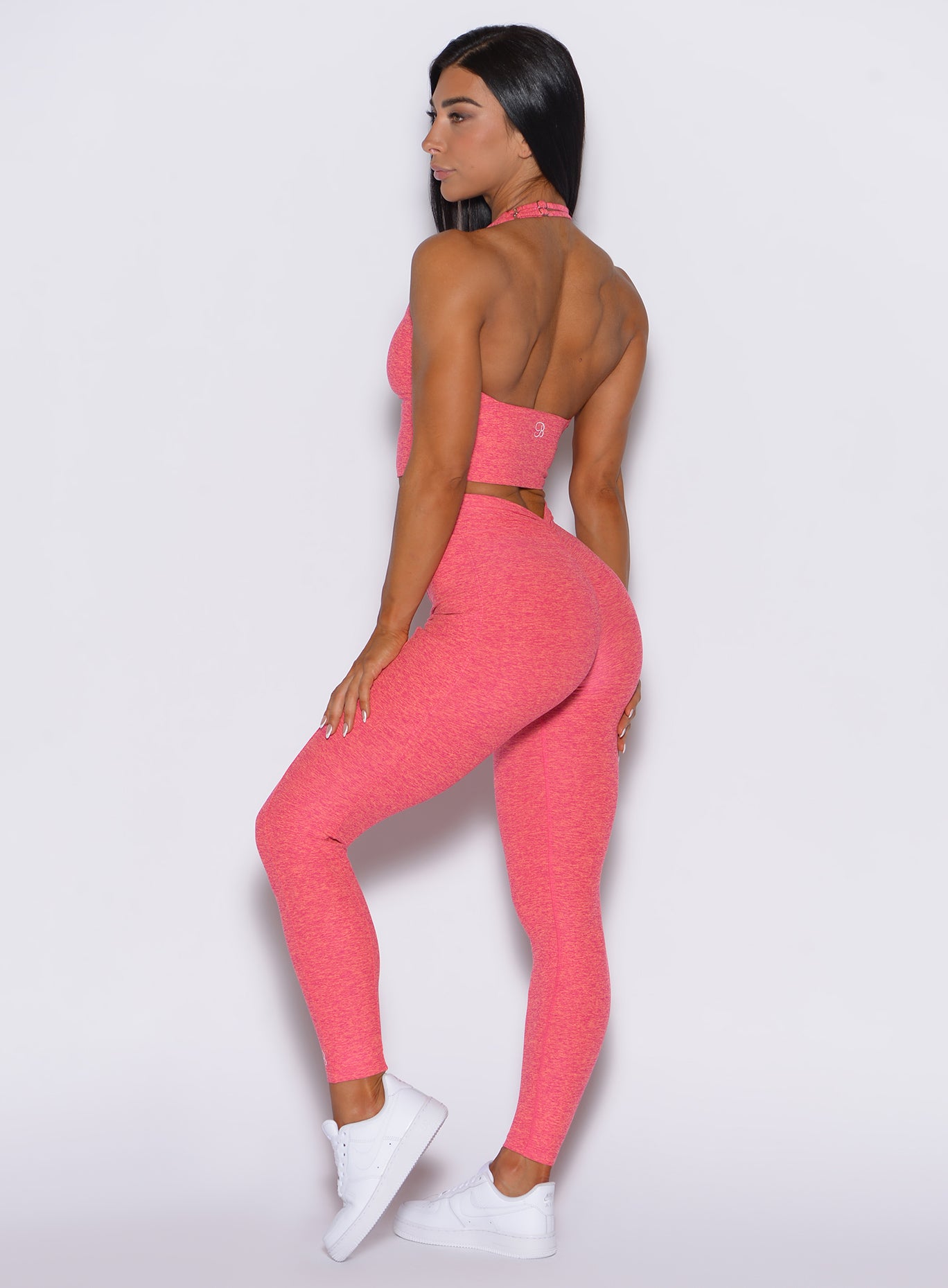 Neon Tangerine Shock V Back Leggings with a sculpting V-scrunch back and side pockets.