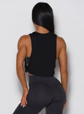 Rear view of the black Ombre Logo Tank featuring a lightweight, flowy fit and open-side detail.