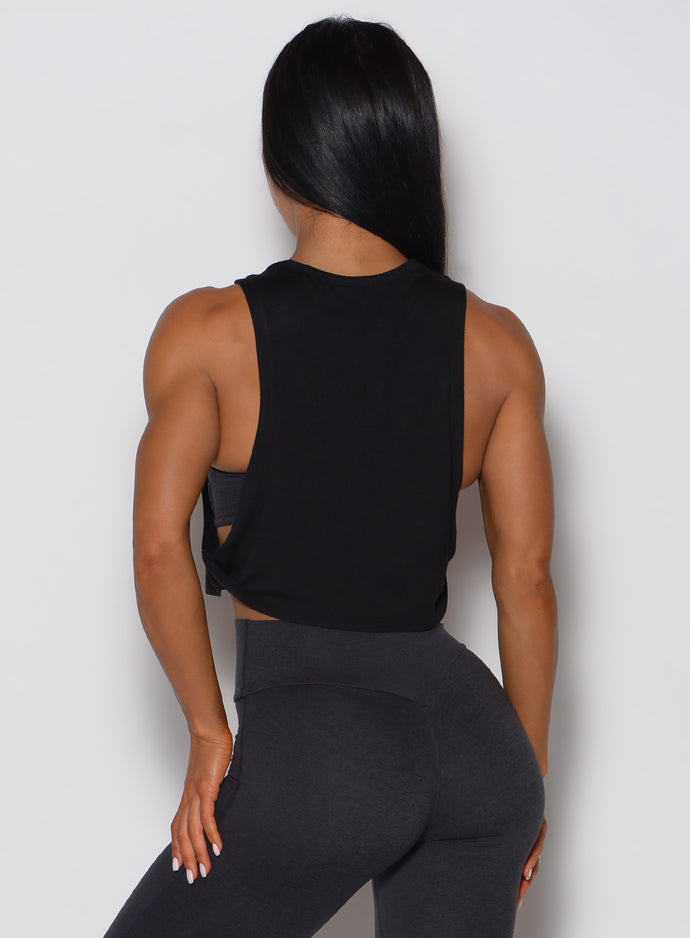 Rear view of the black Ombre Logo Tank featuring a lightweight, flowy fit and open-side detail.