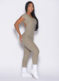 right side profile view of a model wearing the Open Back Tee Bodysuit in Toasted Sugar color