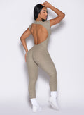 back right side profile view of a model wearing the Open Back Tee Bodysuit in Toasted Sugar color