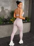 back right side shot of a model in outdoors facing to the right side wearing the Flexfit Leggings in Violet Ice Leopard color