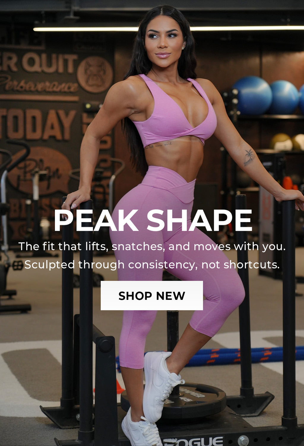 Model wearing pink matching active bra and capri leggings standing in a gym setting. Text overlay says "PEAK SHAPE The fit that lifts, snatches, and moves with you. Sculpted through consistency, not shortcuts." Call to action: SHOP NEW