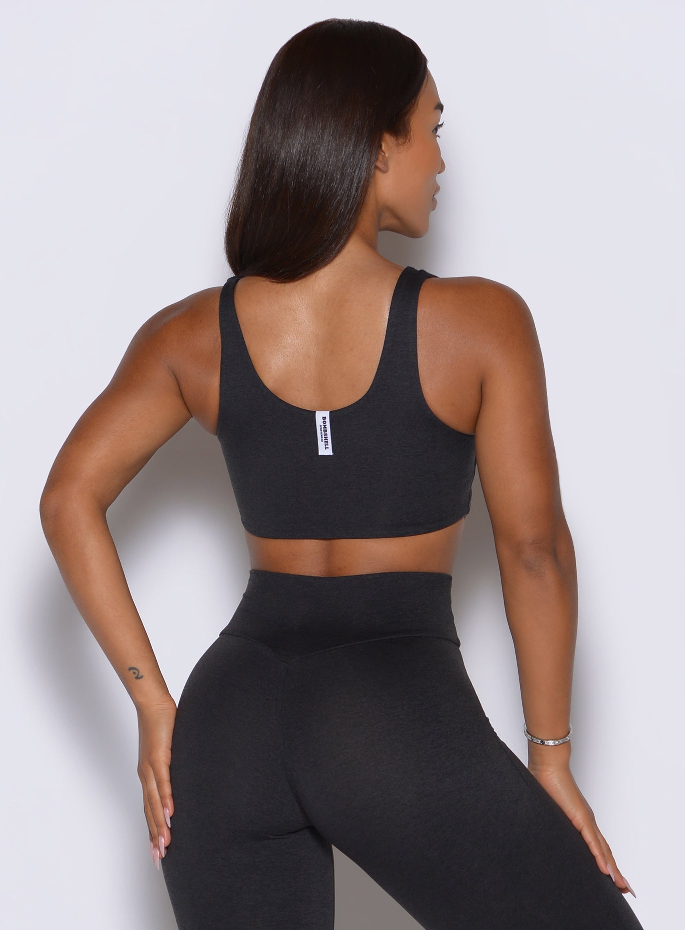 Wide scoop back profile shows the barely-there feel and secure fit of this dark heathered bra.