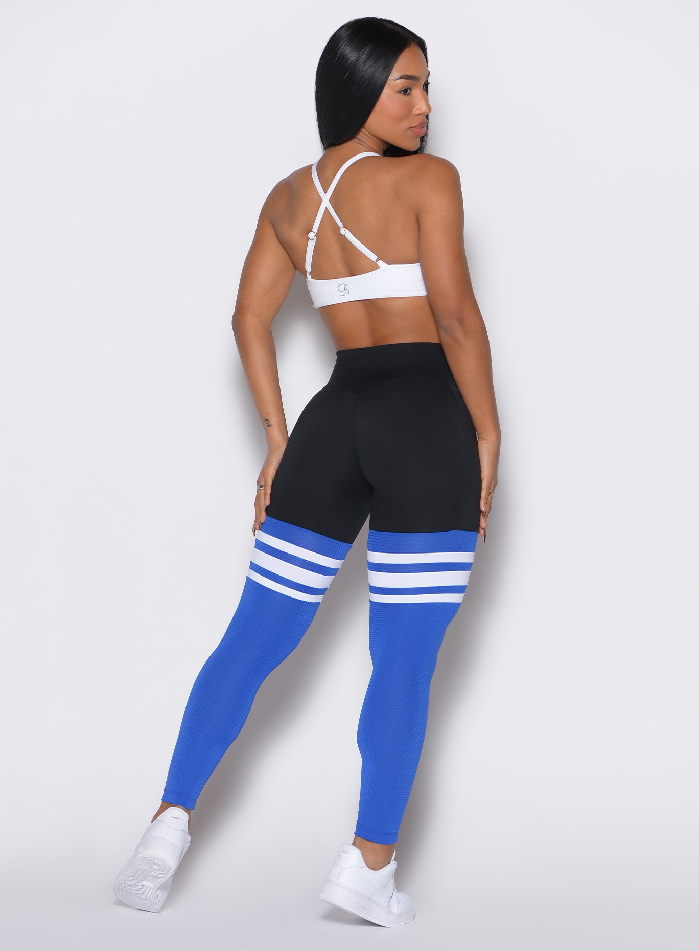 Black Sky Perform Thigh Highs with breathable mesh and side pockets for a sculpted gym look.