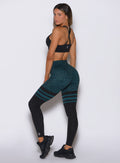 Side view of the breathable mesh panels on the Ocean Teal Cheetah Perform Thigh-Highs