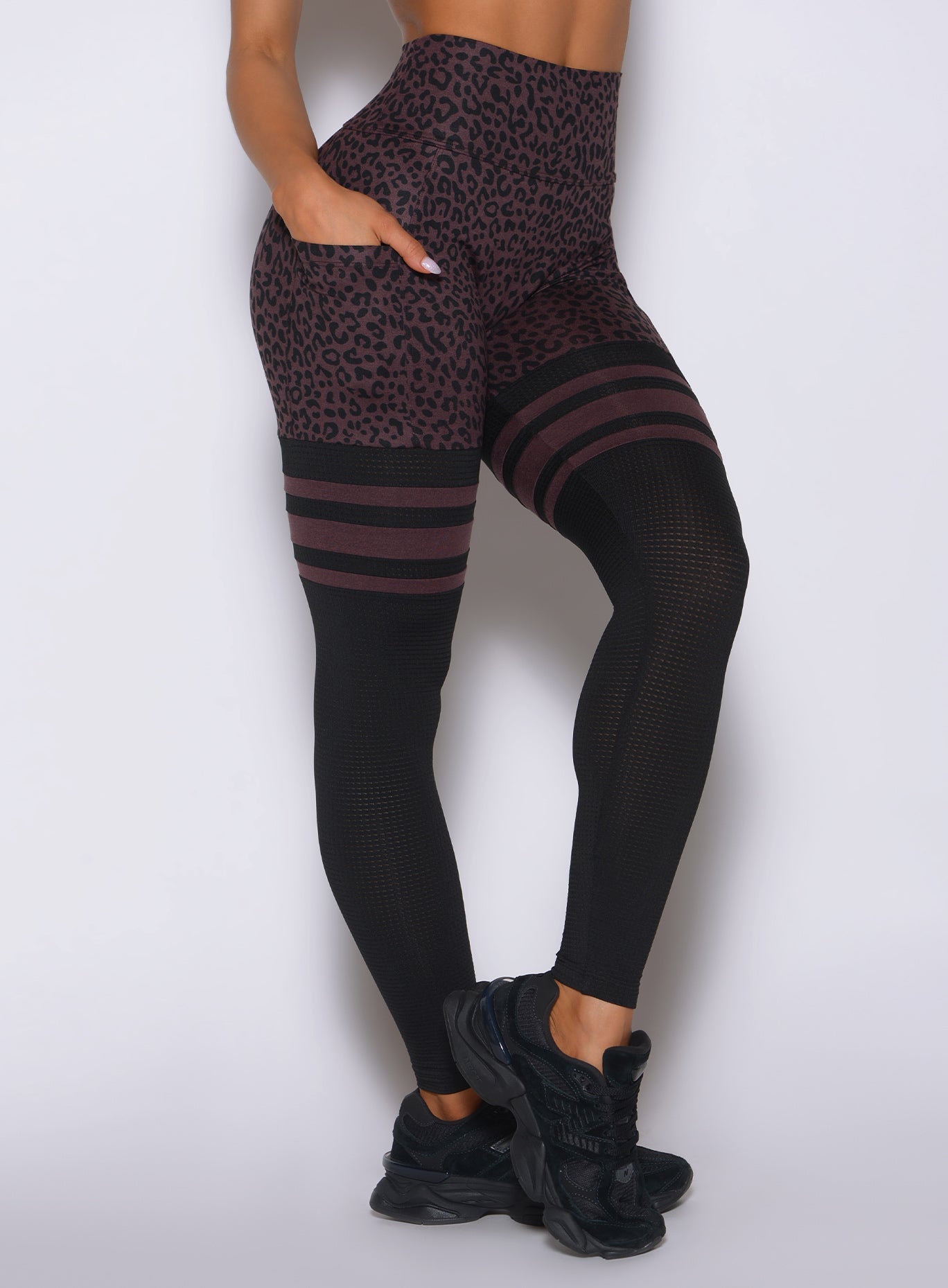 Close-up of the mini cheetah print and side pocket on Peppercorn Cheetah Perform Thigh-Highs