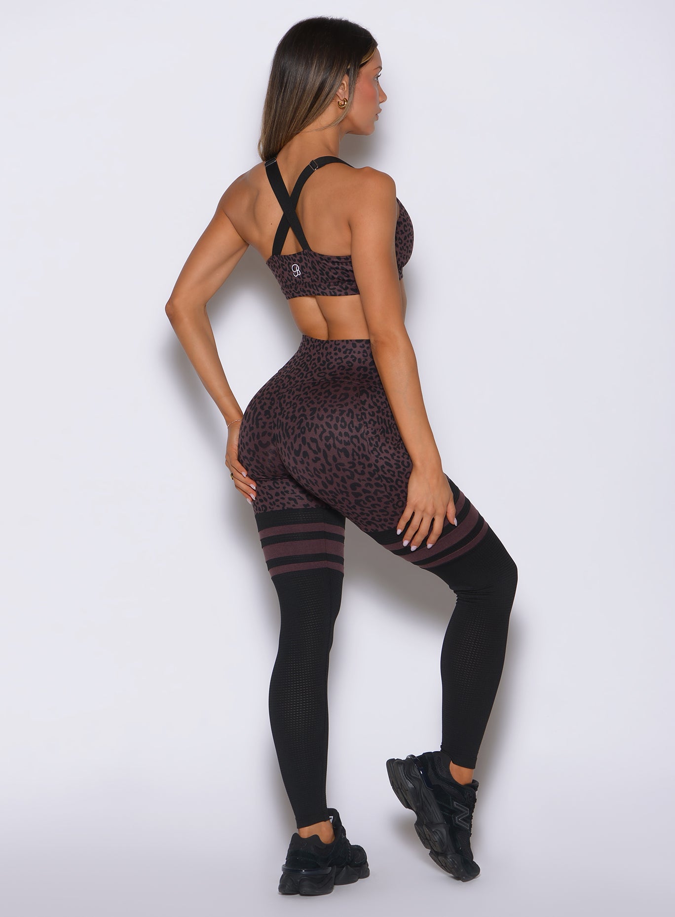 Full rear view of the body-hugging Peppercorn Cheetah Bombshell Sportswear Perform Thigh-Highs