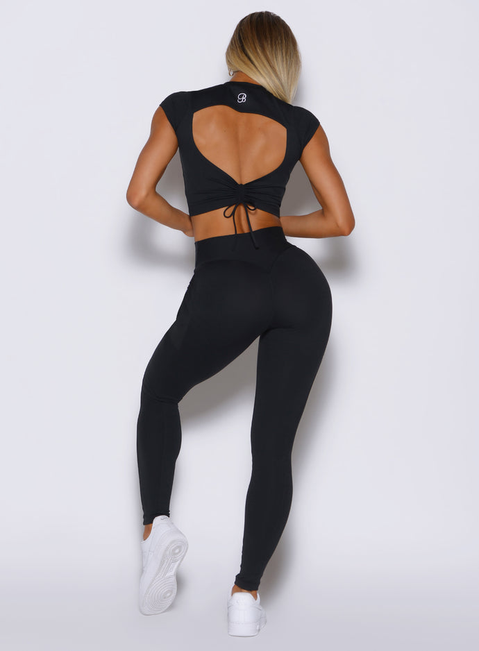 back profile view of a model wearing the PocketBoost Leggings in Black color