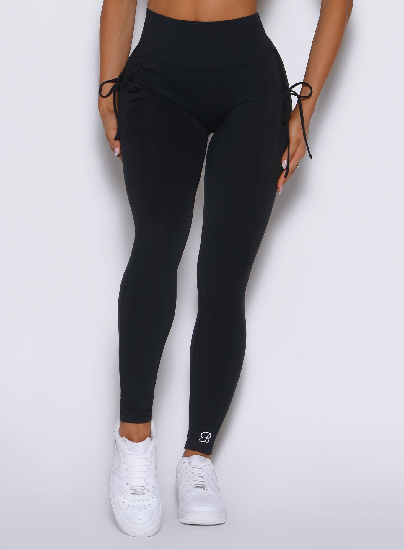 close up front view of a model wearing the PocketBoost Leggings in Black color