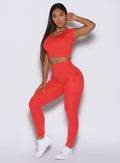 side profile view of a model wearing the PocketBoost Leggings in Command red color