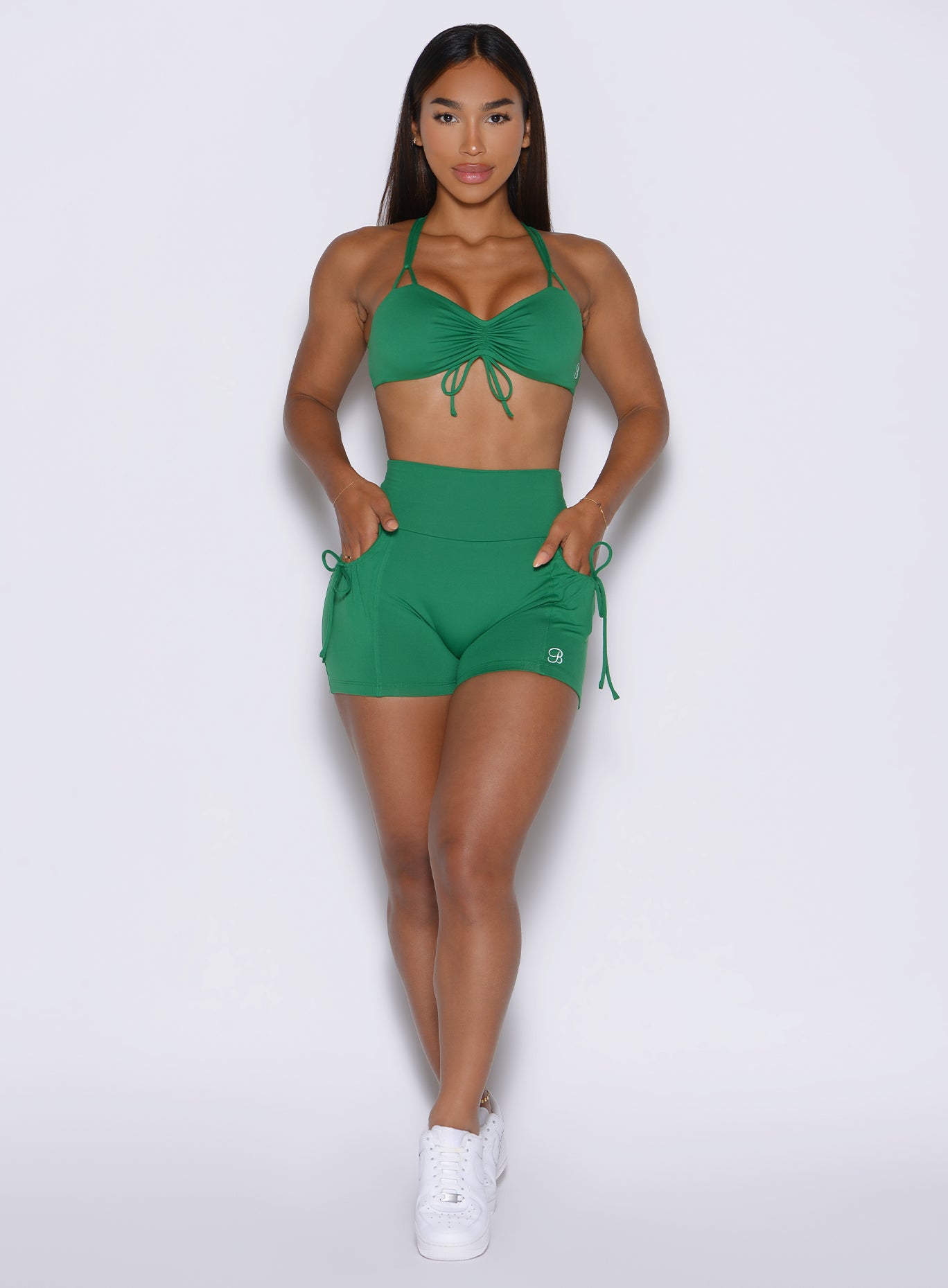 Field Green PocketBoost Shorts featuring a high-waisted fit and functional side pockets.