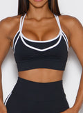 close up front view of a model wearing the Power Line Bra in black color