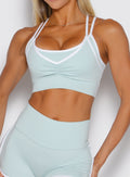 close up front view of a model wearing the Power Line Bra in cool arctic color
