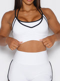 close up front view of a model wearing the Power Line Bra in white color