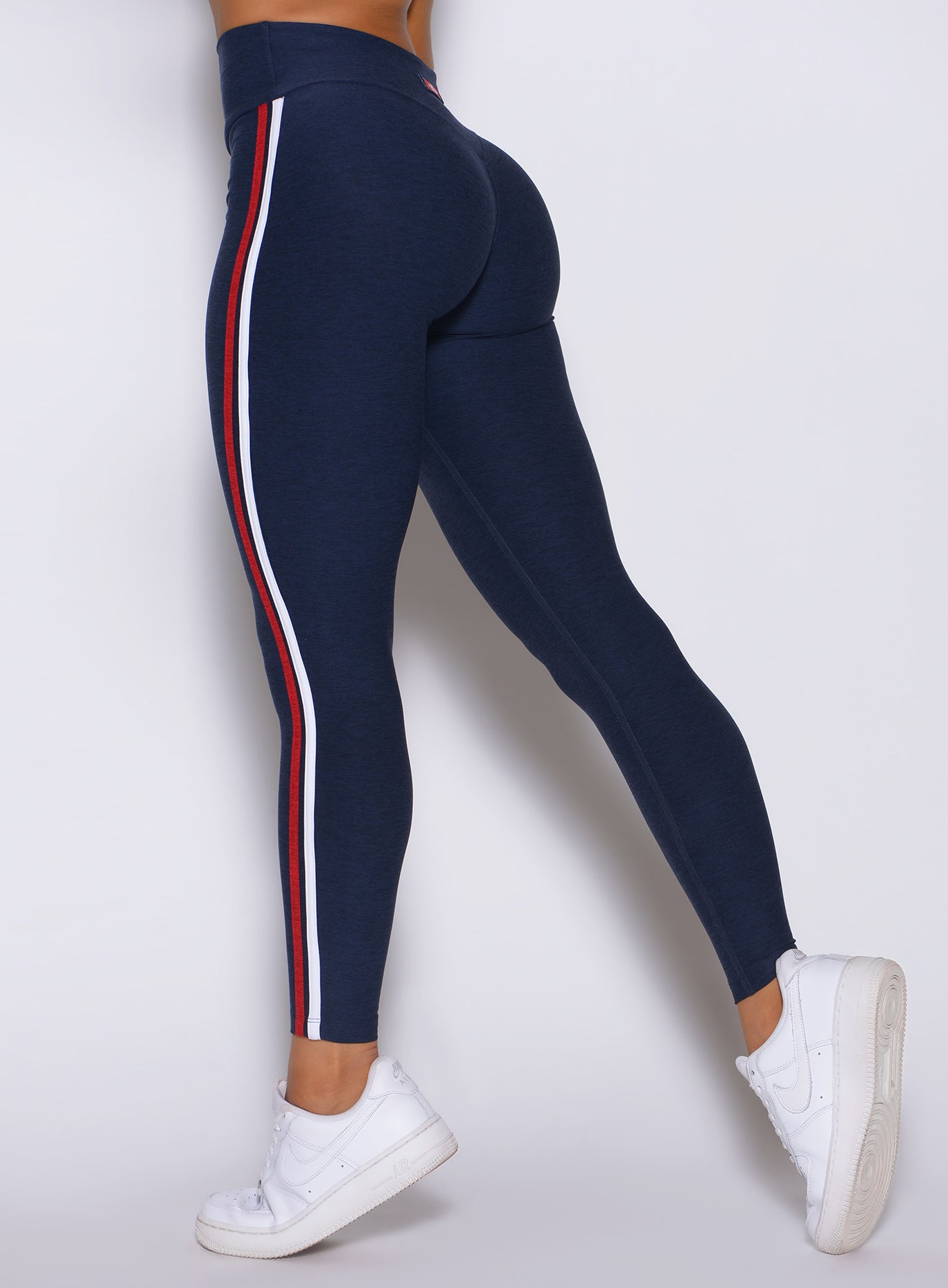 Back-left detail close-up of Cosmic Blue leggings with scrunch shaping and stripe binding trim