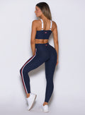 Rear angle of Cosmic Blue Power Play leggings with scrunch shaping and sleek support fit