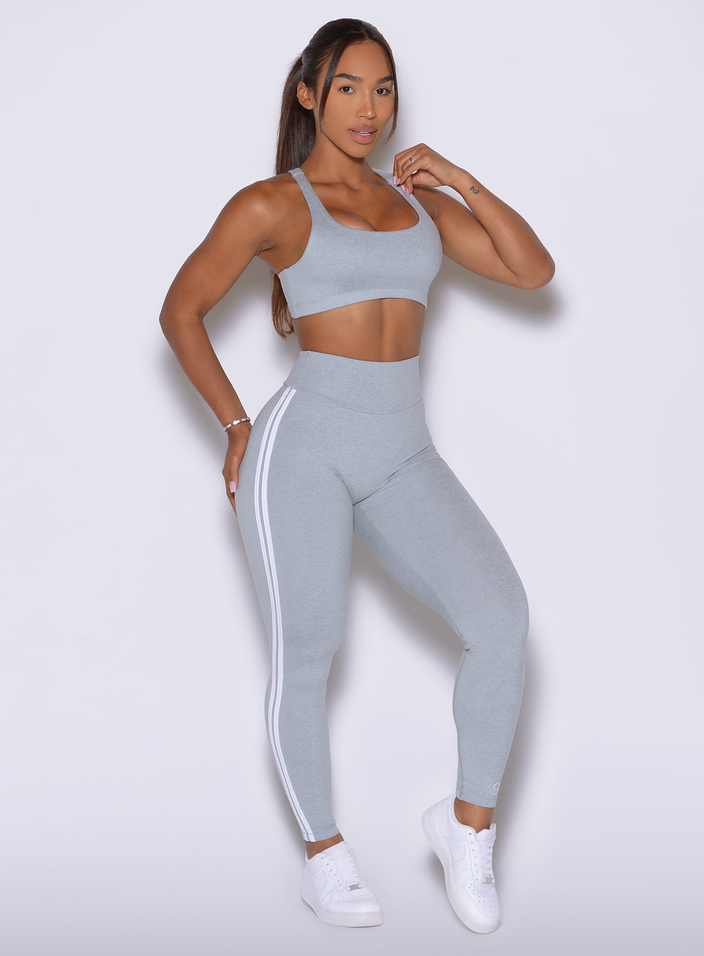 An icy hue brings a fresh edge to these sculpting Power Play leggings with bold side stripes