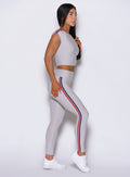 Right profile focuses on the dynamic stripe side binding running down the Ice Power Play legging