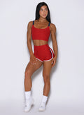 Front view of Sunset Red Power Play shorts in buttery-soft fabric with bold dolphin-style seams