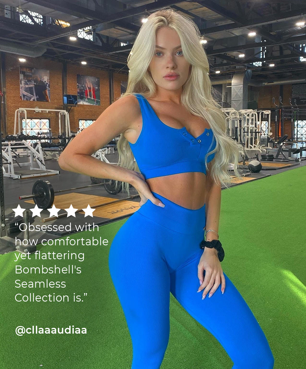 Blonde standing inside a gym in a blue seamless set
