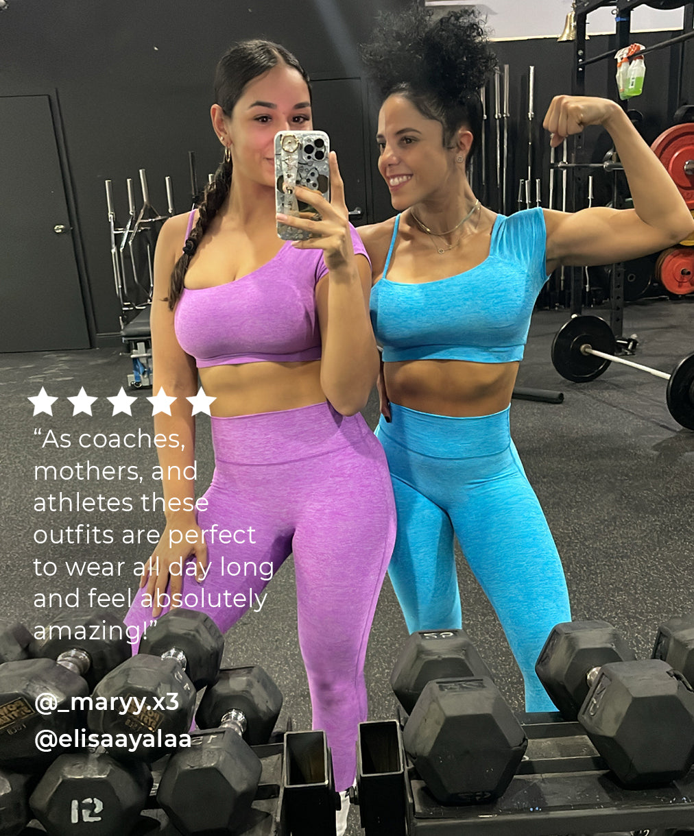 Two women in the gym wearing cute matching activewear sets 